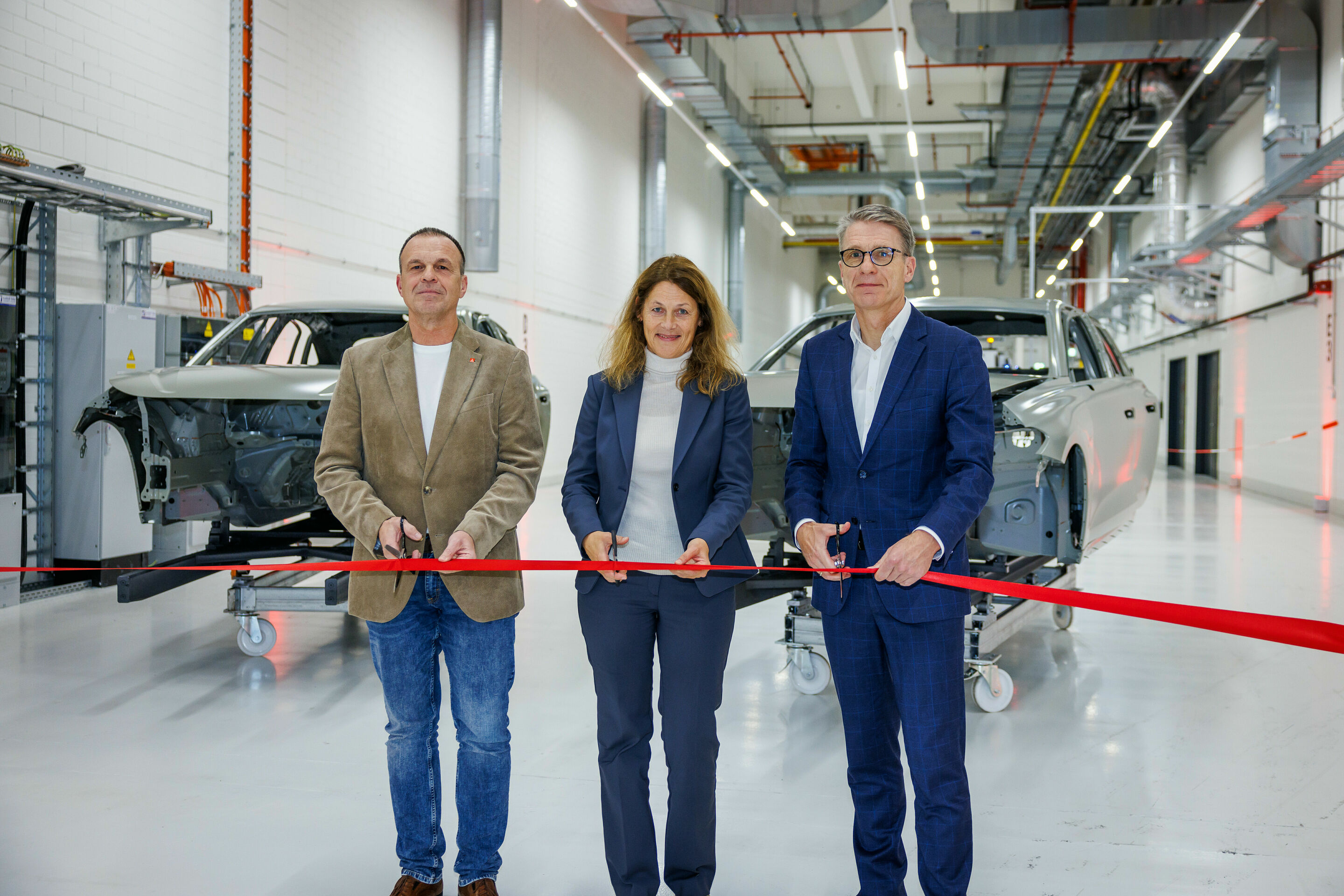 Audi opens new primer facility in Neckarsulm - From left to right: Rainer Schirmer, Chairman of the Works Council; Ursula Noll, Head of Production Planning Paint Shop Corrosion Protection; Fred Schulze, Plant Manager at the Neckarsulm site.