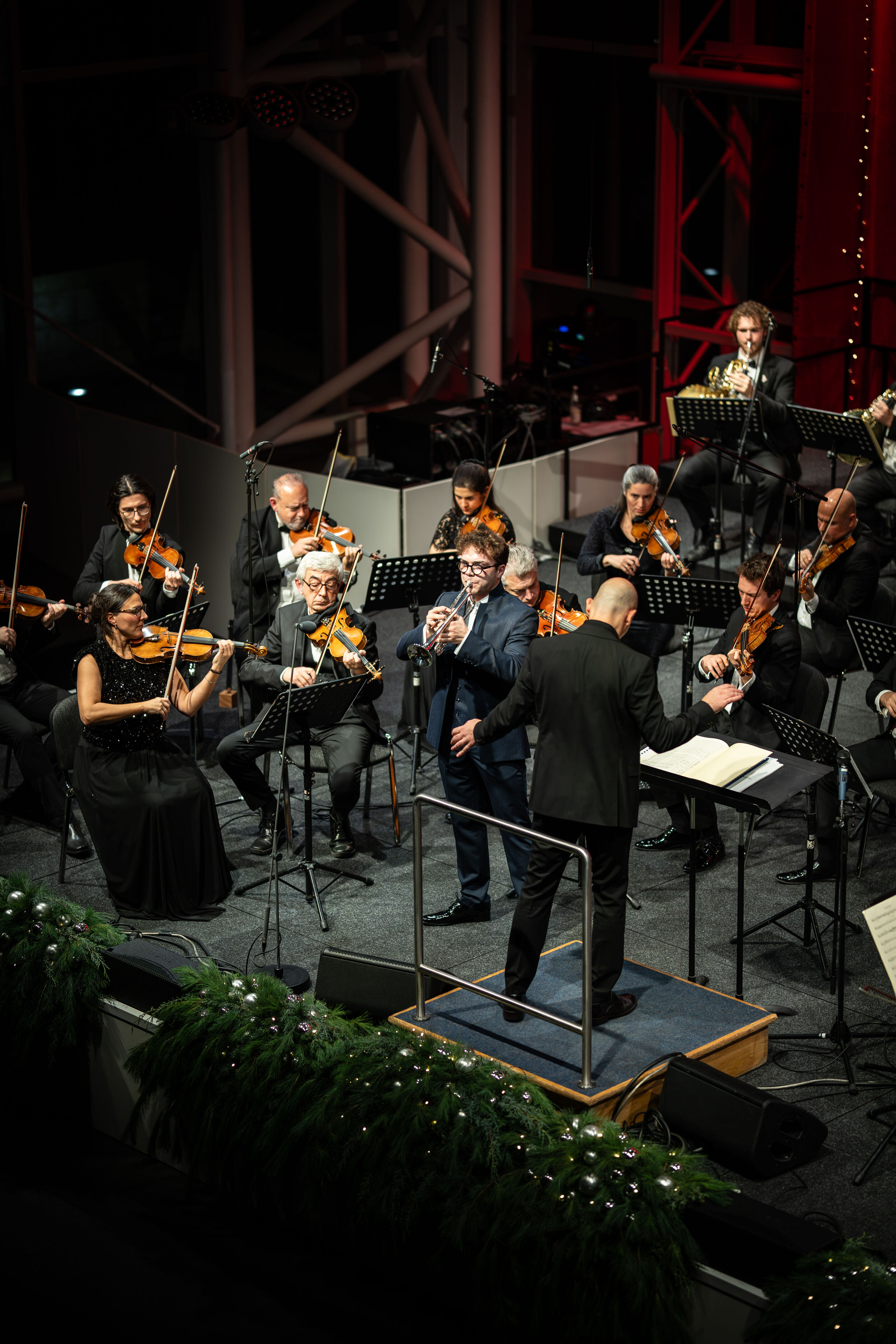 Audi Christmas Concert 2025 - Trumpeter Robin Paillet and the Ingolstadt Chamber Philharmonic, conducted by Ariel Zuckermann, on stage at the Audi Christmas Concert 2025