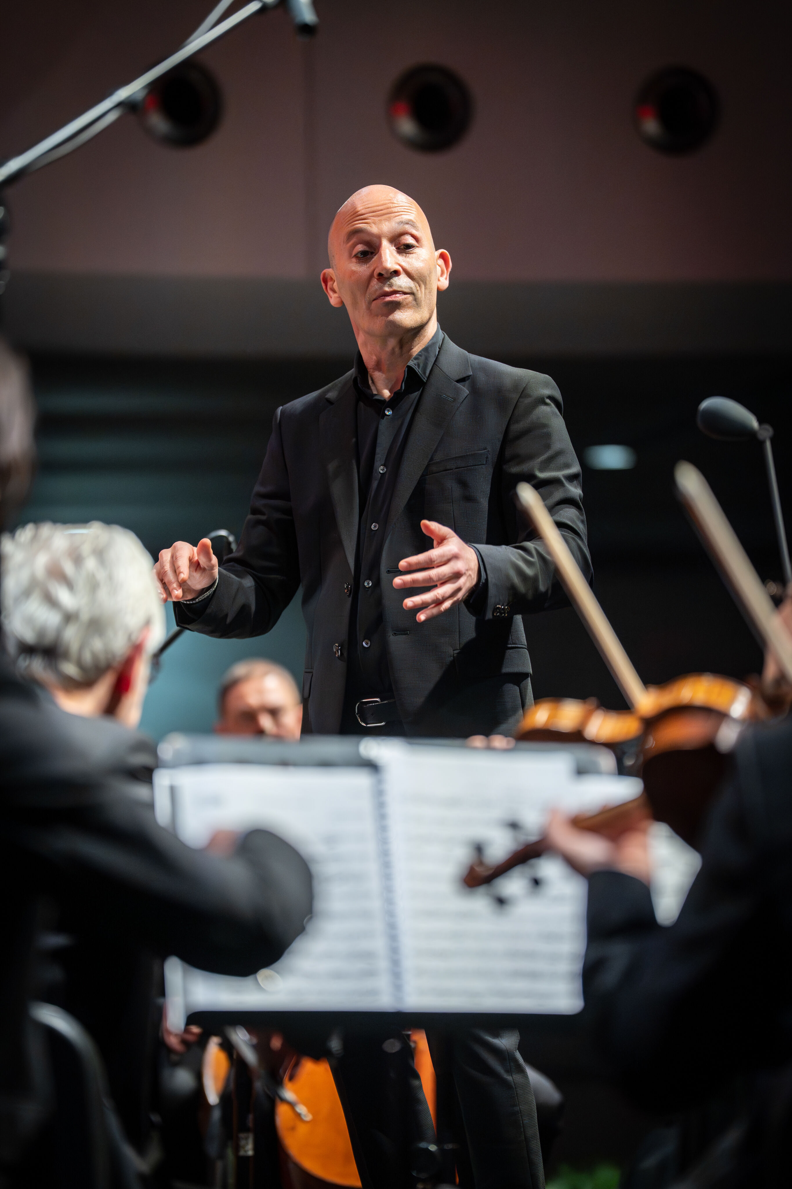 Audi Christmas Concert 2025 - Conductor Ariel Zuckermann leading the Ingolstadt Chamber Philharmonic at the Audi Christmas Concert on December 12, 2025