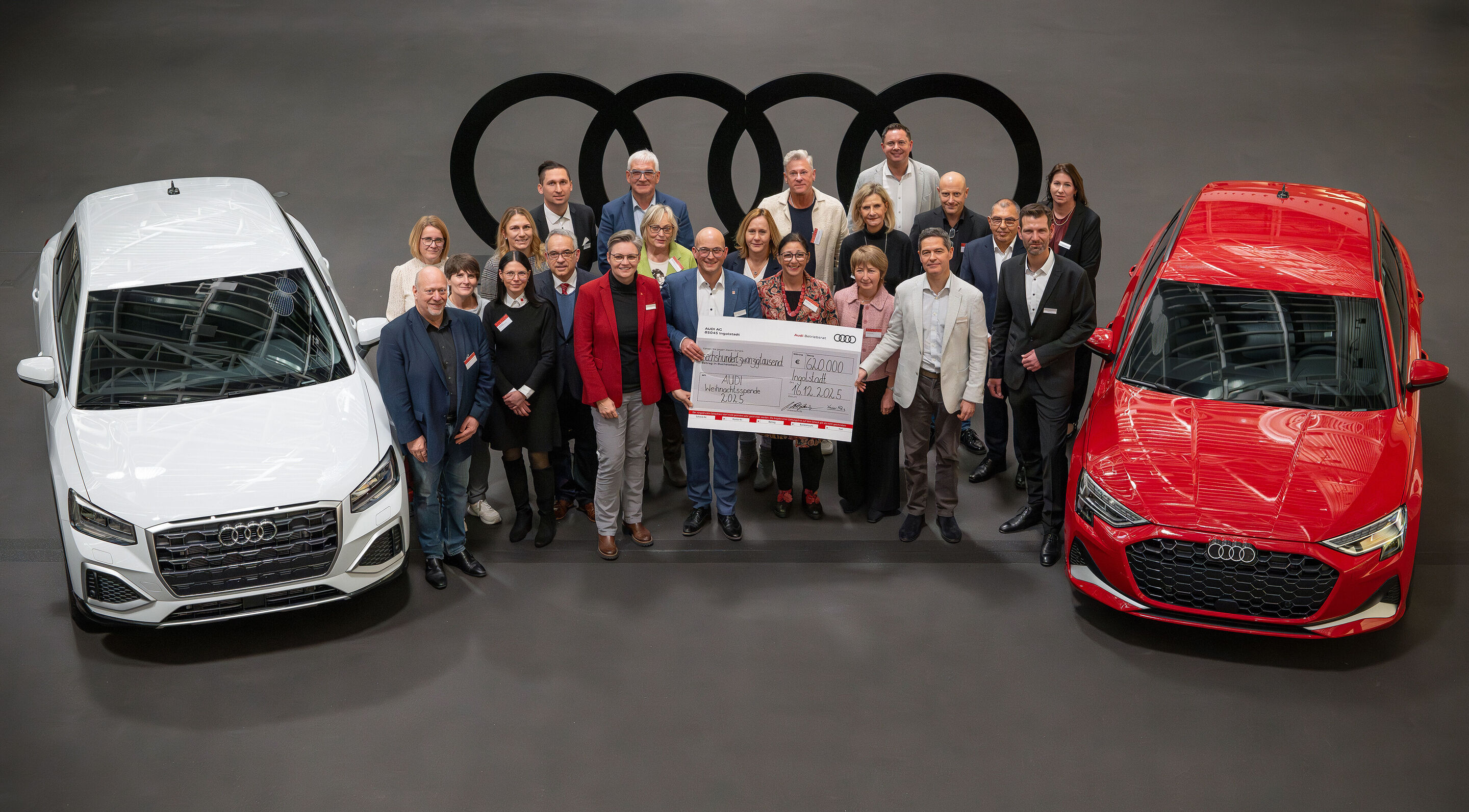 Audi and its employees donate €850,000 to charity - Karola Frank (Deputy Works Council Chair), Works Council Chair Jörg Schlagbauer, and Chief Human Resources Officer Xavier Ros present a symbolic check to representatives of the 92 institutions (from...
